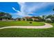 Exterior view showing the building next to a green lawn at 1686 Seascape Cir, Tarpon Springs, FL 34689