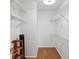 Walk-in closet with metal shelving at 1705 Belleair Forest Dr # B, Belleair, FL 33756