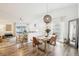 Open-concept dining room with modern lighting, wood floors, and seamless flow to the living area at 1705 Cinnabar Ct, Brandon, FL 33510