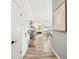 Inviting hallway featuring wood-look flooring, stylish decor, and glimpses of the open-concept living spaces at 1705 Cinnabar Ct, Brandon, FL 33510