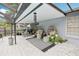 Relaxing covered patio with stylish furniture, decorative plants, and an inviting atmosphere for outdoor living at 1705 Cinnabar Ct, Brandon, FL 33510