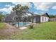Enclosed pool area offers a private retreat, perfect for swimming and relaxation, surrounded by green lawn at 1705 Cinnabar Ct, Brandon, FL 33510