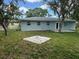 Large backyard offers plenty of space for gardening, play, or relaxation at 1713 Valencia E Dr, Largo, FL 33778
