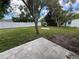 Backyard with lush greenery, providing a serene and private outdoor space at 1713 Valencia E Dr, Largo, FL 33778