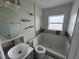 Modern bathroom featuring a unique vessel sink, stylish tile work, and a step-in shower at 1713 Valencia E Dr, Largo, FL 33778