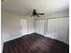 Bedroom with view of closet doors, window and ceiling fan at 1713 Valencia E Dr, Largo, FL 33778