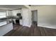Bright kitchen with white cabinets, modern appliances, and durable vinyl floors at 1713 Valencia E Dr, Largo, FL 33778
