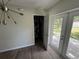 Photo shows the indoor laundry area, just off the back patio at 1713 Valencia E Dr, Largo, FL 33778
