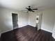 Spacious bedroom with ceiling fan, attached bath and walk in closet at 1713 Valencia E Dr, Largo, FL 33778
