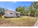 Exterior side view of a single story home with a covered porch and yard space at 1778 27Th N Ave, St Petersburg, FL 33713