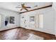 Bright living room featuring textured walls, parquet floors, and natural light from multiple windows at 1778 27Th N Ave, St Petersburg, FL 33713