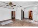 Spacious living room with wood floors, multiple doors, and a unique glass block feature at 1778 27Th N Ave, St Petersburg, FL 33713