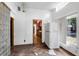 Open living room with a view to the kitchen, featuring wood floors and glass block feature at 1778 27Th N Ave, St Petersburg, FL 33713