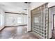 Spacious living room with wood floors, multiple doors, and a unique glass block feature at 1778 27Th N Ave, St Petersburg, FL 33713