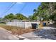 View of a fenced in side yard with trash bins at 1778 27Th N Ave, St Petersburg, FL 33713