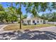 Street view of single-story home with simple design and mature trees on the property at 1778 27Th N Ave, St Petersburg, FL 33713