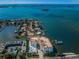 Stunning aerial view showcasing the condo complex, waterfront, and surrounding neighborhood at 1860 N Fort Harrison Ave # 106, Clearwater, FL 33755