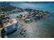 Aerial view of waterfront community with boat docks and surrounding residences at 1860 N Fort Harrison Ave # 106, Clearwater, FL 33755