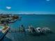 Aerial view of the waterfront property with multiple boat lifts and docks, offering direct access to the open water at 1860 N Fort Harrison Ave # 106, Clearwater, FL 33755