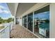 Spacious balcony with tile flooring, railing, and sliding doors, offering outdoor living space at 1860 N Fort Harrison Ave # 106, Clearwater, FL 33755