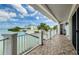 Relaxing balcony with waterfront views, overlooking the serene surroundings at 1860 N Fort Harrison Ave # 106, Clearwater, FL 33755