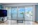 Sliding glass doors open to scenic waterfront views from the private balcony at 1860 N Fort Harrison Ave # 106, Clearwater, FL 33755