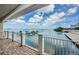 Breathtaking water view from the condo's balcony, overlooking boat docks and a serene bay at 1860 N Fort Harrison Ave # 106, Clearwater, FL 33755