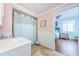 Clean bathroom featuring modern fixtures and an open layout to the bedroom at 1860 N Fort Harrison Ave # 106, Clearwater, FL 33755