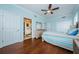 This is a bedroom featuring light blue walls and an attached bathroom at 1860 N Fort Harrison Ave # 106, Clearwater, FL 33755