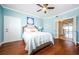 Bright bedroom features hardwood floors and ensuite access to living area at 1860 N Fort Harrison Ave # 106, Clearwater, FL 33755