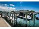 A private boat dock featuring a lift system, providing convenient and secure boat storage with easy access to the water at 1860 N Fort Harrison Ave # 106, Clearwater, FL 33755