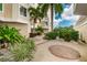 Lush courtyard featuring manicured gardens and brick-lined walkways, creating a tranquil outdoor space at 1860 N Fort Harrison Ave # 106, Clearwater, FL 33755