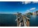 Boat in boat lift and private dock on the water, ideal for boating enthusiasts and waterfront living at 1860 N Fort Harrison Ave # 106, Clearwater, FL 33755