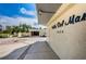 Inviting entrance to Villa Del Mare, with well-maintained landscaping and covered parking at 1860 N Fort Harrison Ave # 106, Clearwater, FL 33755
