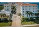 Beautiful exterior of a multi-story building with lush landscaping and a well-maintained driveway at 1860 N Fort Harrison Ave # 106, Clearwater, FL 33755