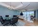 Open living area with a view of the water, with stylish furniture, and lots of natural light at 1860 N Fort Harrison Ave # 106, Clearwater, FL 33755