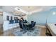 Comfortable dining and living space offering an open floor plan with water views and stylish lighting at 1860 N Fort Harrison Ave # 106, Clearwater, FL 33755