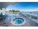 Outdoor pool and hot tub with waterfront views, perfect for relaxation and enjoying the coastal scenery at 1860 N Fort Harrison Ave # 106, Clearwater, FL 33755