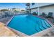 Community pool with lounge chairs in waterfront building overlooking harbor at 1860 N Fort Harrison Ave # 106, Clearwater, FL 33755