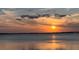 Golden hour sunset over tranquil waters at 1860 N Fort Harrison Ave # 106, Clearwater, FL 33755