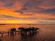 Beautiful waterfront view with boats docked at sunset, highlighting a peaceful and serene coastal setting at 1860 N Fort Harrison Ave # 106, Clearwater, FL 33755