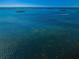 Scenic waterfront shot with clear blue waters and distant islands, conveying a serene and expansive view at 1860 N Fort Harrison Ave # 106, Clearwater, FL 33755