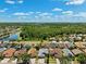 Beautiful aerial view of the neighborhood with lush greenery and scenic lakes at 19750 Ellendale Dr, Land O Lakes, FL 34638