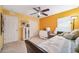 Bright bedroom features a ceiling fan, large windows, and ample closet space at 19750 Ellendale Dr, Land O Lakes, FL 34638