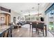 Spacious room with hardwood floors, leather sofa, and connected kitchen and dining area at 19750 Ellendale Dr, Land O Lakes, FL 34638