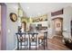 Well-lit kitchen featuring stainless steel appliances, granite countertops, and eat-in island at 19750 Ellendale Dr, Land O Lakes, FL 34638