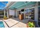 Relaxing screened lanai with custom bar, ceiling fan, and view of the sparkling pool at 19750 Ellendale Dr, Land O Lakes, FL 34638