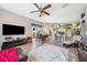 Open floor plan with view of dining, kitchen, hardwood floors, and lots of natural light at 19750 Ellendale Dr, Land O Lakes, FL 34638