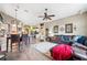 Spacious room with hardwood floors, leather sofa, and connected kitchen and dining area at 19750 Ellendale Dr, Land O Lakes, FL 34638