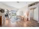 Bright living room featuring wood floors, neutral walls, and access to the pool at 19750 Ellendale Dr, Land O Lakes, FL 34638